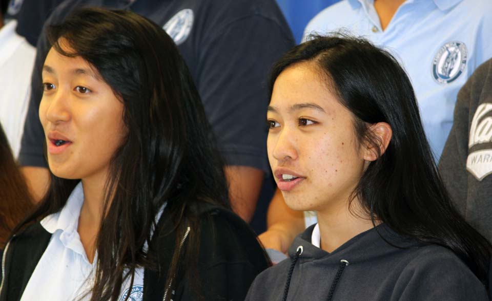 Kelly Luis and Kamie-Lei Fujiwara, members of the Na Mele Choir, sing in a repeat performance of their Na Mele o Maui competition numbers as part of the schools annual Art Week lunchtime activities.