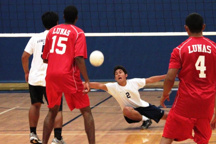 Junior Kekoa Uyechi save the ball while playing against the Lahainalunas at the KS gym on April 10, 2012. The Warriors lost three of the four sets.