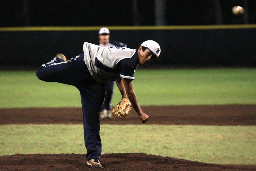 TJ Kanamu pitches a ball against the Maui High Sabers at the Iron Maehara Stadium on March 27, 2013. The Warriors lost 2-6.