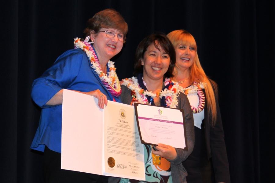 Ms. Noelani Yatsushiro stands with NBPTSs Andrea Hajek and Christy Levings with her National Board Certificate on February 3, 2014. She was one of four KS educators and 11 Maui educators who were honored that night.