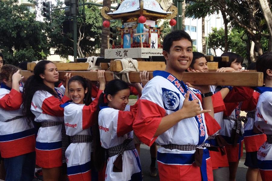 The Japanese Club heads out at the start of the Honolulu Festival parade in Waikīkī, March 9. Their design won the Maui Mikoshi design contest, and they won the privilege of carrying the mikoshi, brought to reality by the contest. coordinators.