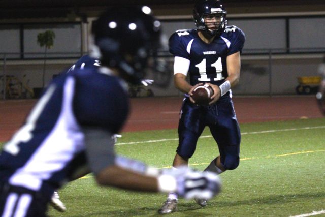 Chase Newton with possession of the ball in the football game against King Kekaulike High School on Friday, Sept. 5 at Kanaiaupuni Stadium. King Kekaulike won 23-13.