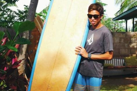 Yours truly with one of my favorite longboards, ready to do what I love - surf. Give it a try, and you might like it, too.