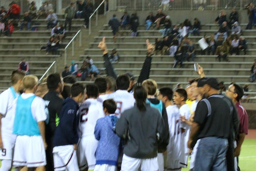 Coach Kane Pelezzotto raises his arms in celebration of the Bears 1-0 win over King Kekaulike at the MIL Division 1 Boys Soccer playoffs, Wednesday, February 11, at Kanaʻiaupuni Stadium. Baldwin advances to the state tournament, which begins next Friday, February 20.