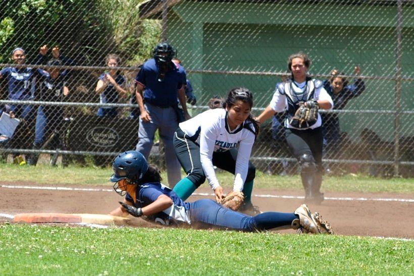 Kylee Kaala Corpuz safely slides back to first before Nā Aliʻi attempts to tag her out at Eddie Tam field #1 on April 18, 2015, in a game against Nā Aliʻi. The Warriors won, 6-3.