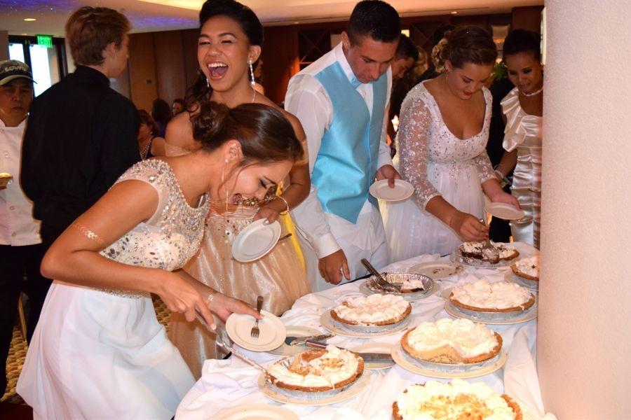 Rachel Hillen and Pohaikealoha Artates have fun at the dessert table along with Keola Paredes and Ayla Forsythe at the junior prom at the Kamehameha Golf Course Clubhouse, April 24, 2015.