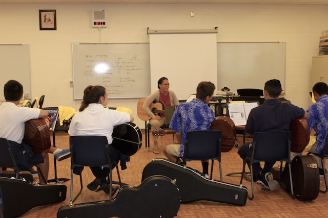 Kumu Kalei Aarona-Lorenzo speaks in front of her guitar class, the first to be offered at Kamehameha Maui and beginning in 2015. The class is meant to round out the KSM music program.