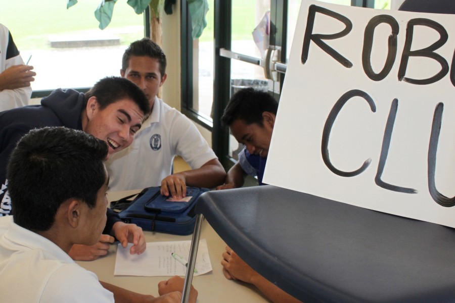 Zack Fasi signs up for Robotics Club at Club Sign-Up Day held in Keeaumokupapaiaheahe on Wednesday, August 26, 2015. The event was moved indoors due to bad weather associated with Hurricane Jimena.
