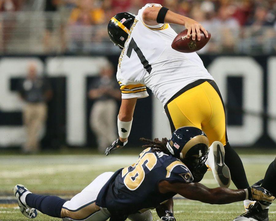Pittsburgh Steelers quarterback Ben Roethlisberger is tripped up by St. Louis Rams safety Mark Barron for a five-yard sack during third quarter action on Sunday, Sept. 27, 2015, at Edward Jones Dome in St. Louis. (Chris Lee/St. Louis Post-Dispatch/TNS)