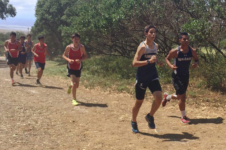 Sophomore Cy Ornellas runs at the HPA invitational meet held on the Big Island, Sept. 24. Athletes from around the state got a try at the state competition course.
