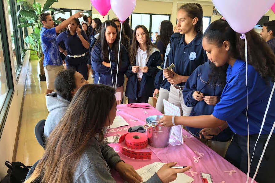 Leialoha Medeiros and Jade Vila sell pink passes for $1. 