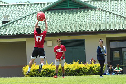 Day 1, Seniors vs. Freshmen: Senior Daryn Nakagawa catches the ball kicked from one of the freshmen.