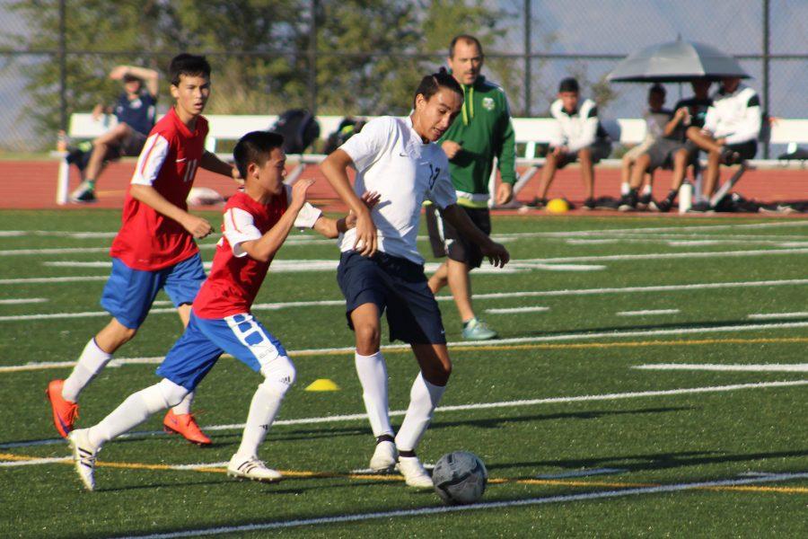 Sophomore Aikalaokekainalu Chappell keeps the ball under control from the Lunas. The jv boys gained their third consecutive win with a 4-0 rout of the Lunas.