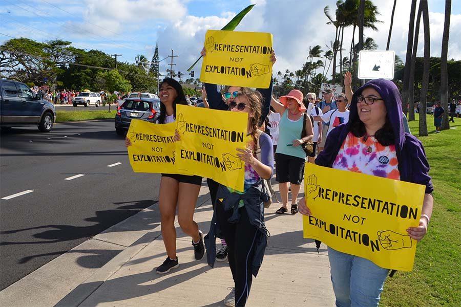 Allies for Equality members march for womens rights Saturday morning, Jan. 21, along Kaʻahumanu Avenue.