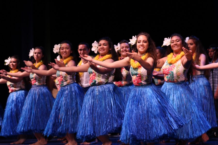 The Hawaiian Ensembleʻs hula group performs to the mele sung by the choir. The Hawaiian Ensemble hosted an open dress rehearsal to make final changes and for the participants ʻohana to watch.