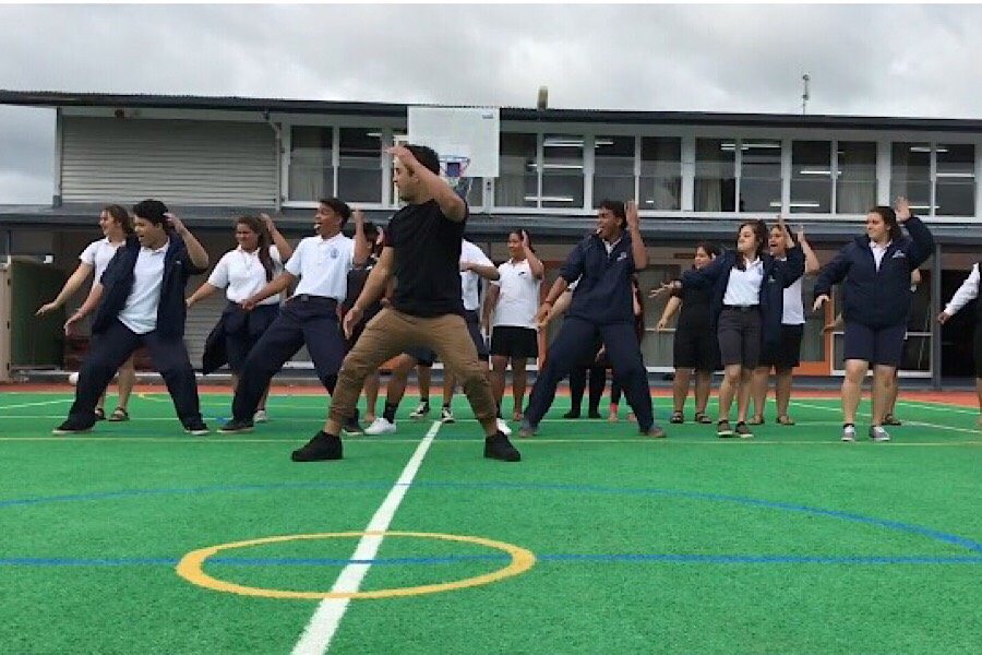 Hawaiian Ensemble students showcase the haka at one of the schools they visited in Aotearoa in late March. At the school, the group was split into three teams to attend workshops. One involved learning the haka.