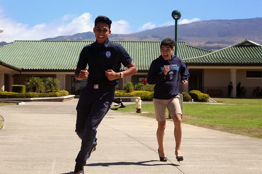 Senior Michael Singh passes freshman Jonah Saribay as they make the run for the finish line. Kamehameha Schools Maui hosted a Walk a Mile in Her Shoes event Oct. 19.