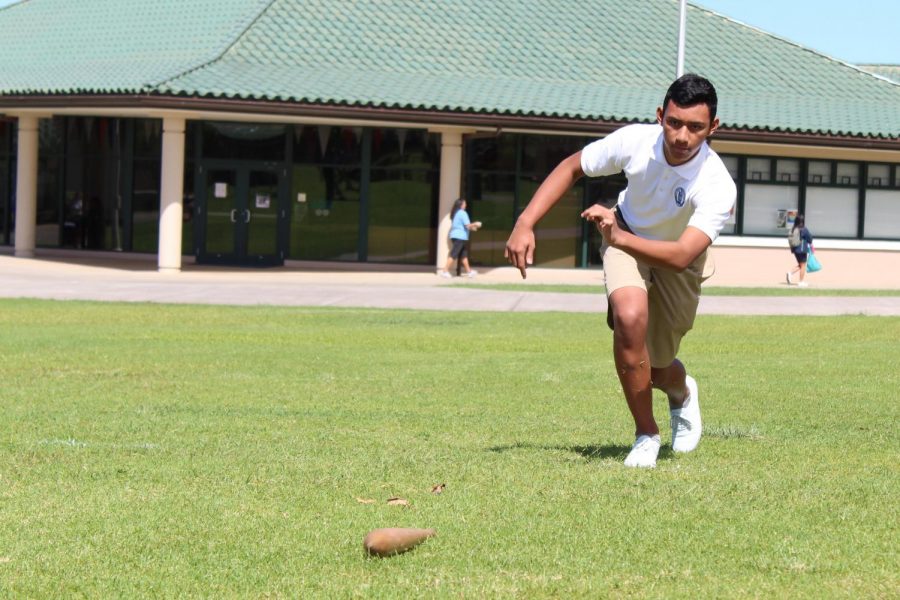 Freshman Kihaapiilani Kahalehau competes in the Moa Pahee game against his classmates. Haumāna within their papa competed against one another to place first and move on to the final round against the other classes.