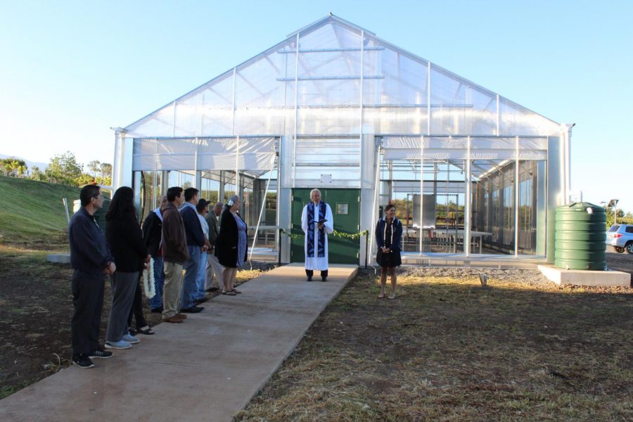 Staff, groundskeepers, administrators, and haumāna witness the opening of Hale Uliulimau. The ceremony included an explanation of the name, a blessing and the cutting of a maile lei.