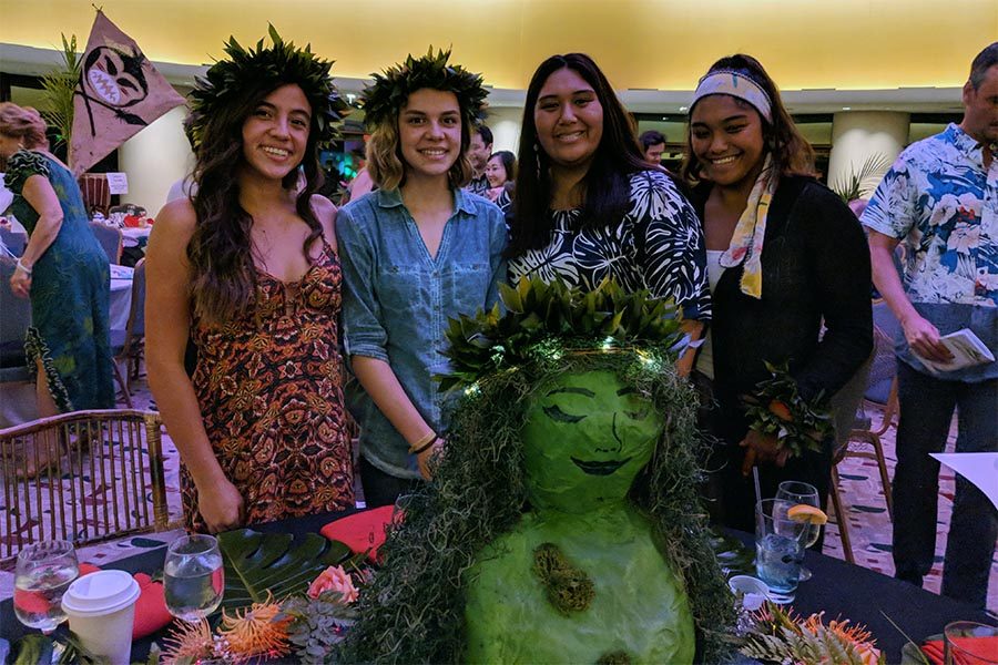 Korey Cadiz, Kawai Kupuni, Hoala Alapai, and Maui High senior Kealani Alapai with the centerpiece of their award-winning table design. On Mar. 11 at the King Kamehameha Golf Club, these four high school students designed a table for the 21st annual Women Helping Women fundraiser. This years fundraiser theme was Restoring the Heart: Hoʻokele Puʻuwai.