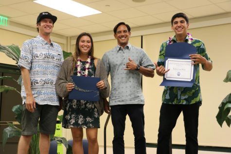 Seniors Kamalei Roback and Kahiau Luat-Hueu receives the Most Outstanding Athlete award for surfing.