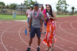Keynote speaker Malia Medeiros praises her former coach, Alika Asing. She said that he not only helped her to become a state champion wrestler, but he is also an example of the values Ke Aliʻi Pauahi envisioned at Kamehameha Schools.