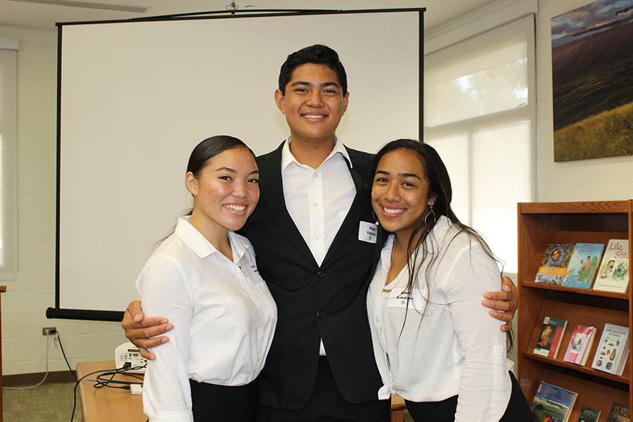 Seniors Taylor Morita, Elijah Vendiola, and Janae-Mika Kanoe Kahahane are all smiles after finishing their Hōʻike Nui presentations, Friday, November 8. After a stressful day presenting to staff and the community, seniors were treated to ice cream in Keʻeaumokupāpaʻiaheahe.