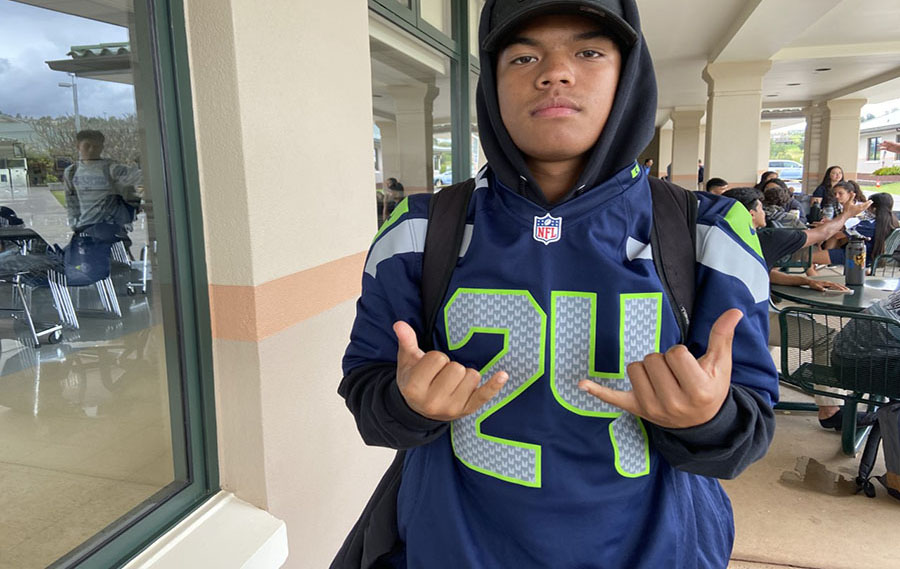 Junior Coian Hett shows off his Marshawn Lynch Seattle Seahawks jersey after a long day at school.