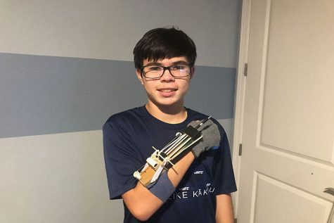 Jaxson Pahukula and the wrist-mounted skewer launcher he prototyped while isolating at his house during the COVID 19 quarantine. Pahukula enjoys building and engineering in his spare time.