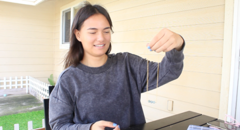 Caitlyn Duarte shows off one of the necklaces she made during our interview. Her company, Naleiko Jewelry, is the fulfillment of one of her dreams.