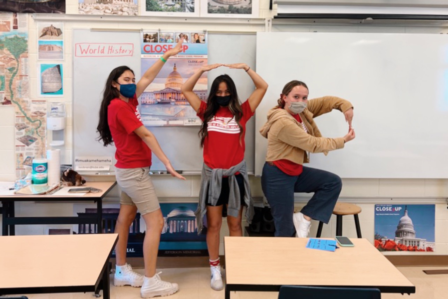 Carly Zablan, Sienna Kamalani and Maile Kehano finish their first scavenger hunt task in Mr. OʻBrienʻs class for a Lā Kūʻokoʻa session Here, they are spelling out his initials: KOB.