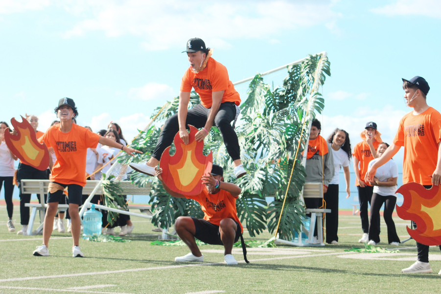 Papa Kou performs a show-stopping move during the lip sync battle at the homecoming pep rally Friday, Dec. 10, at Kanaiaupuni Stadium. For the first time in nearly two years, the student body gathered in person for an all-high school event, with masks on.