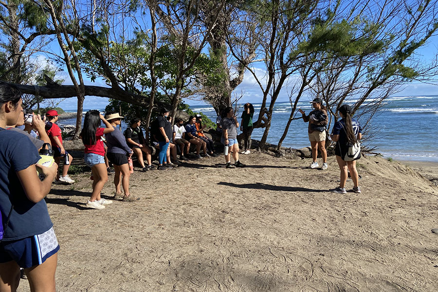 Senior Tahan Valdez gives safety directions and reads out the history of the beach at Waihee Refuge as KSM volunteers prepare for a day of community service, Saturday, January 22.