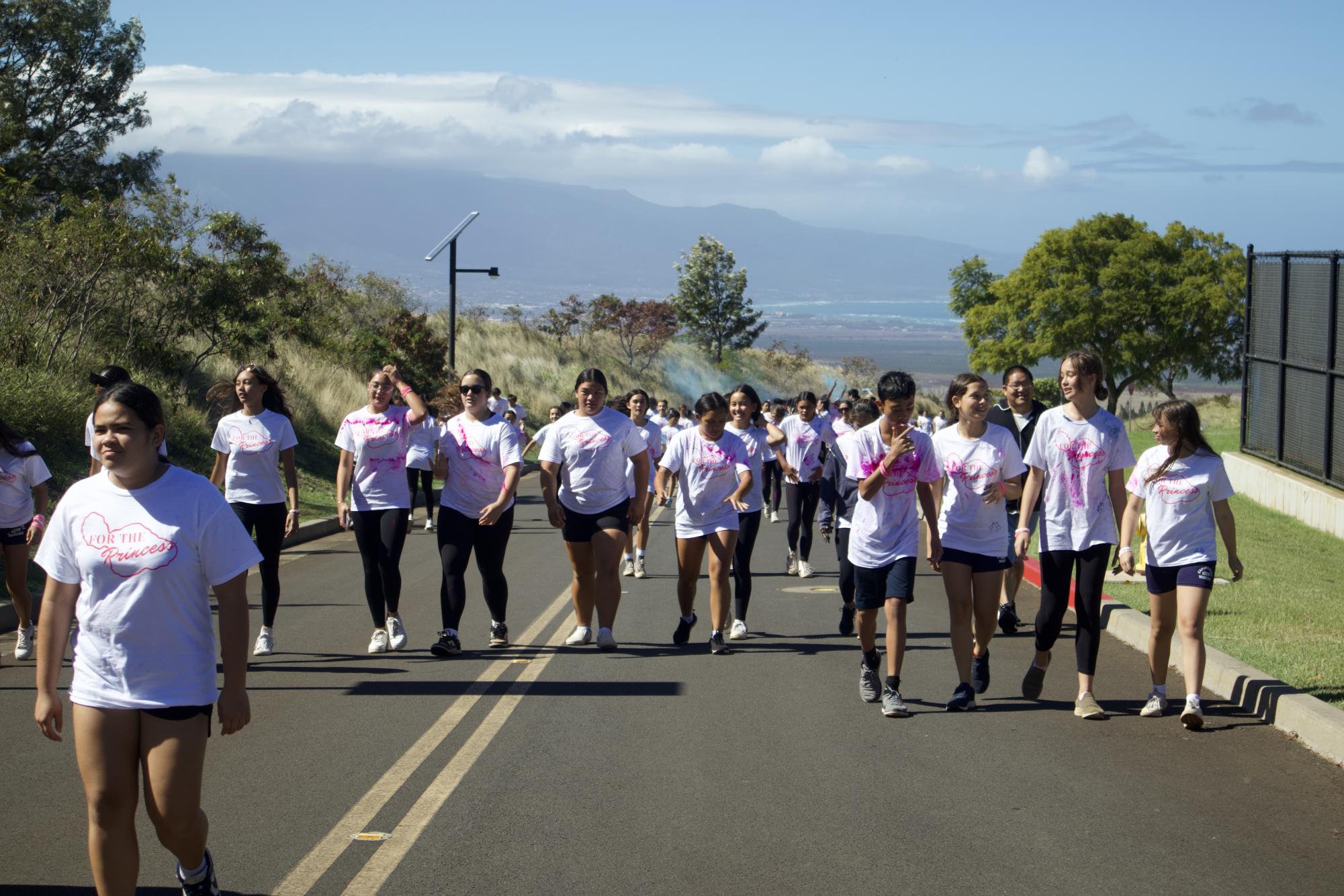 Students grades 6-12 walk through campus, participating in this year's Color Run to show off their school spirit and love for Pauahi.