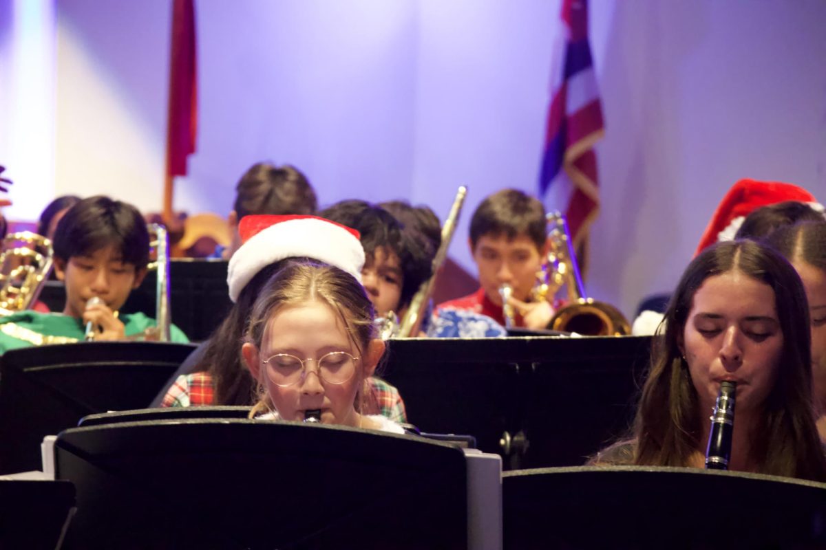 Seniors and Chamber Band members Ava Rutherford-Storm (left) and Anuhea Kelly showcase their Christmas spirit through playing the clarinet. -- photo courtesy of Jared Pendergraft