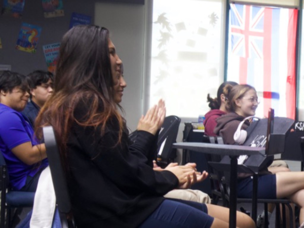 Junior Sienna Fukino and senior Ava Rutherford-Storm are among the amazed students applauding after the world-class concert.